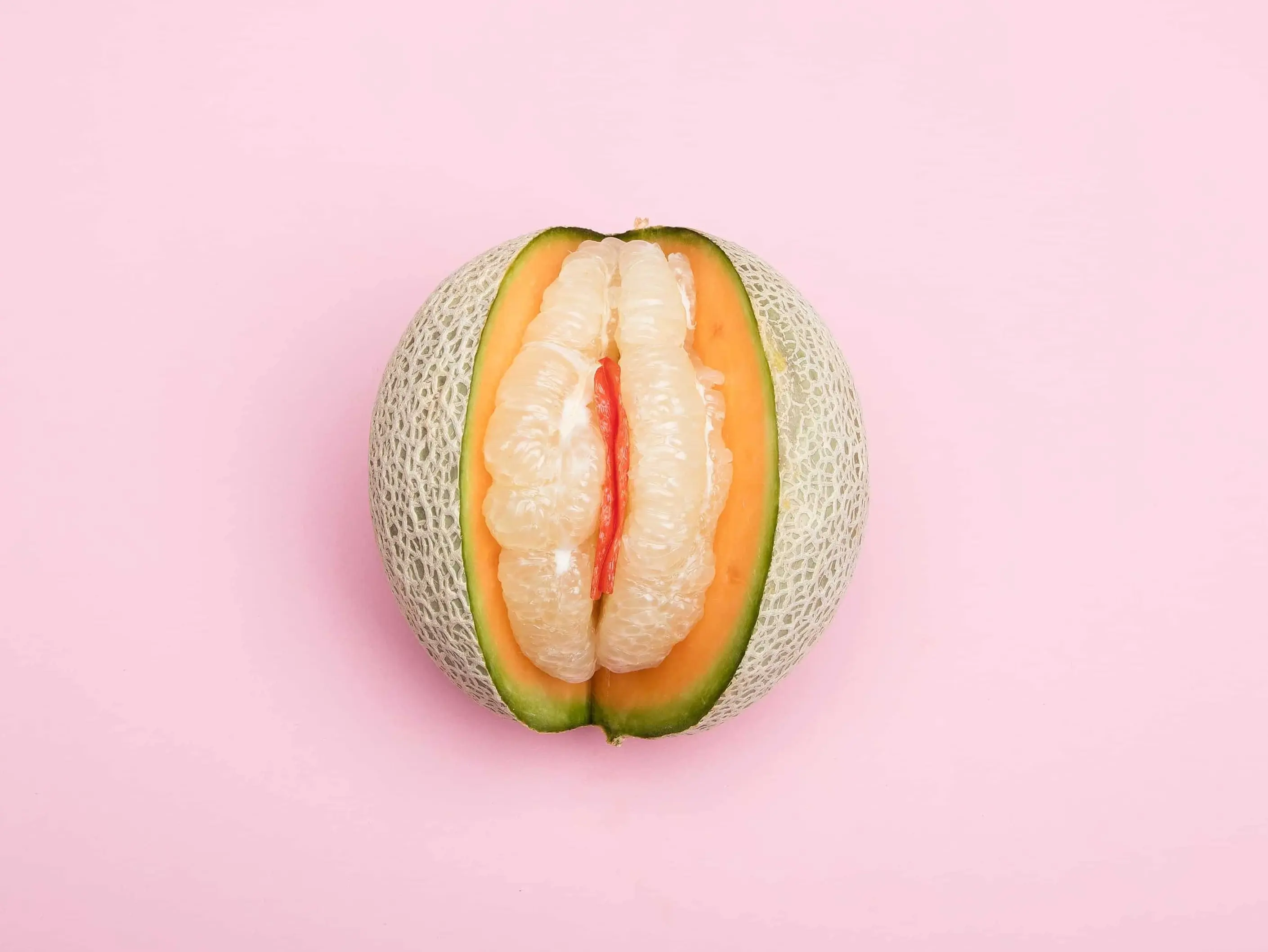 Picture of a melon on a pink background